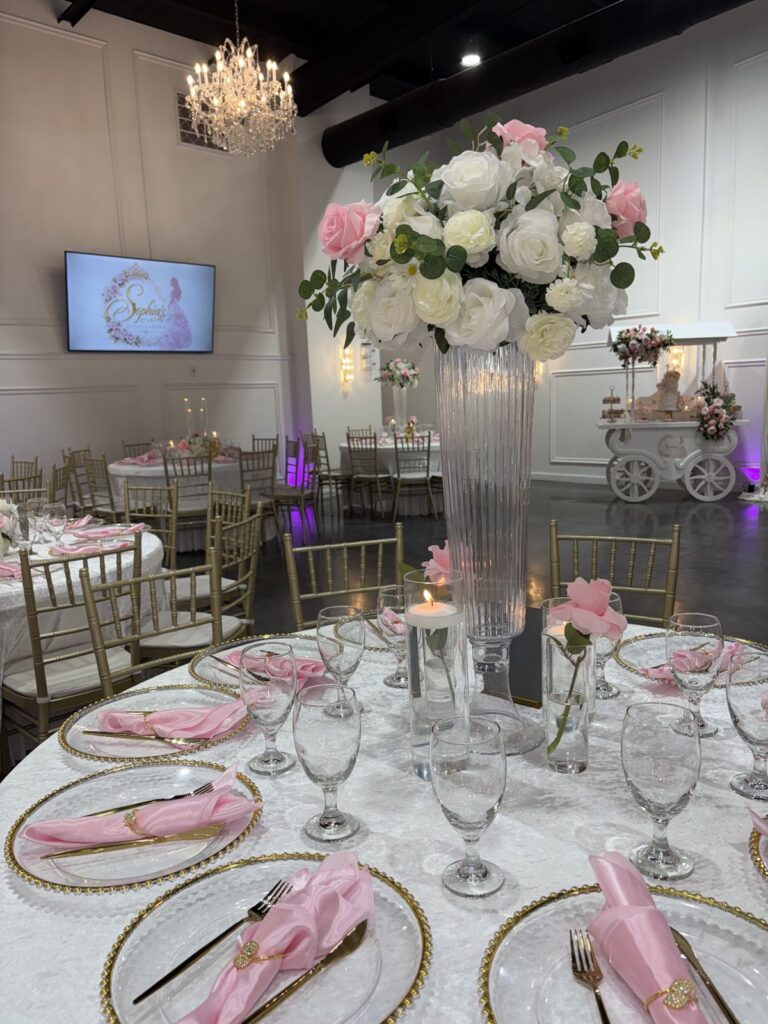 Quinceañera tablescape with pink florals at The Grand UpperRoom, Katy TX