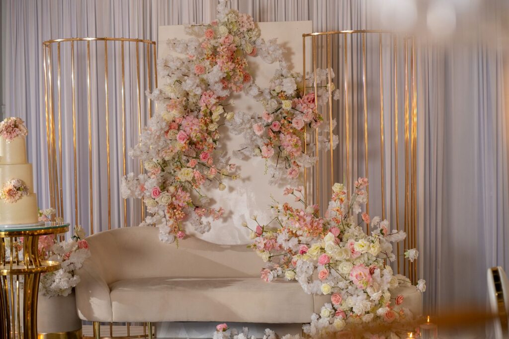 Wedding ceremony backdrop with florals at The Grand UpperRoom wedding venue in Katy