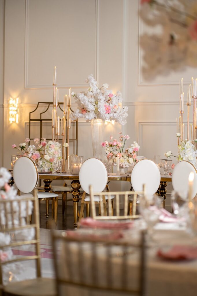 Wedding reception room with Chiavari chairs and florals at The Grand UpperRoom in Katy